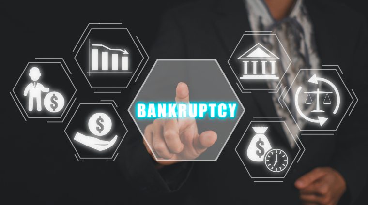 Bankruptcy concept, Business woman hand touching bankruptcy icon on virtual screen.