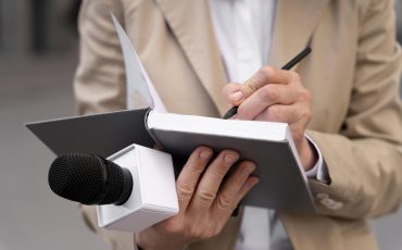 female-journalist-taking-notes